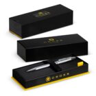 A silver Cross pen in a black and yellow gift box, shown open and closed.