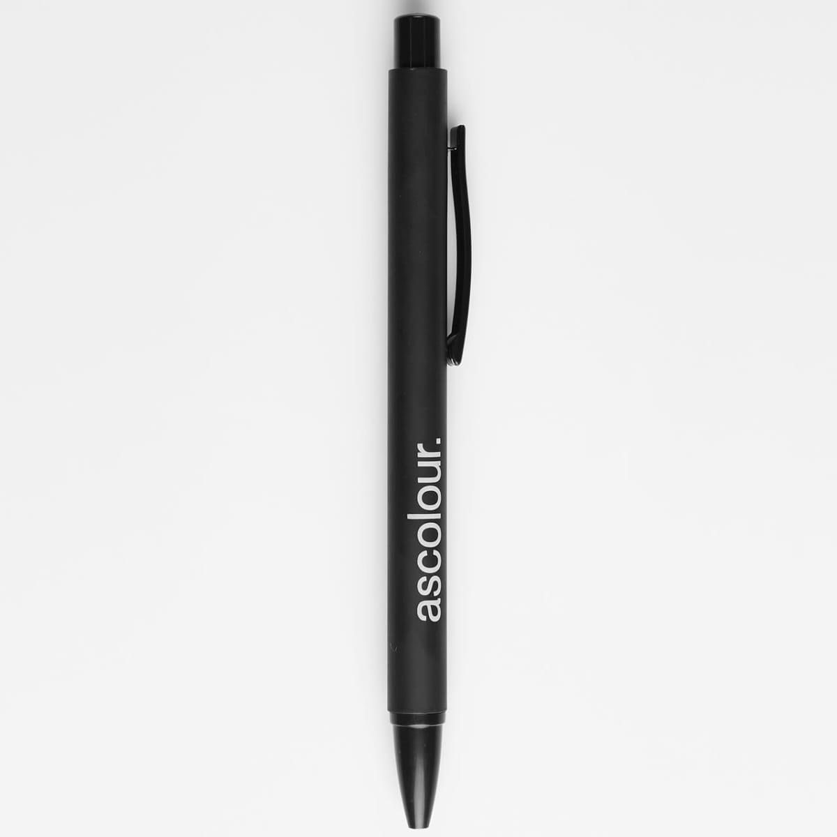 Black pen with ascolour. written in white along the side, on a white background.