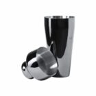Two stainless steel cocktail shaker cups, one standing upright and one lying on its side.