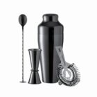 Black cocktail shaker set with jigger, strainer, and mixing spoon on a white background.