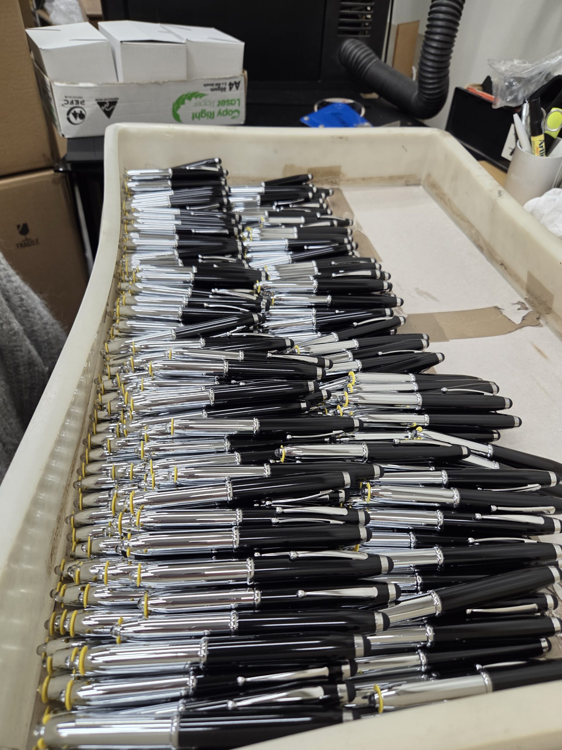 box of promotional pens