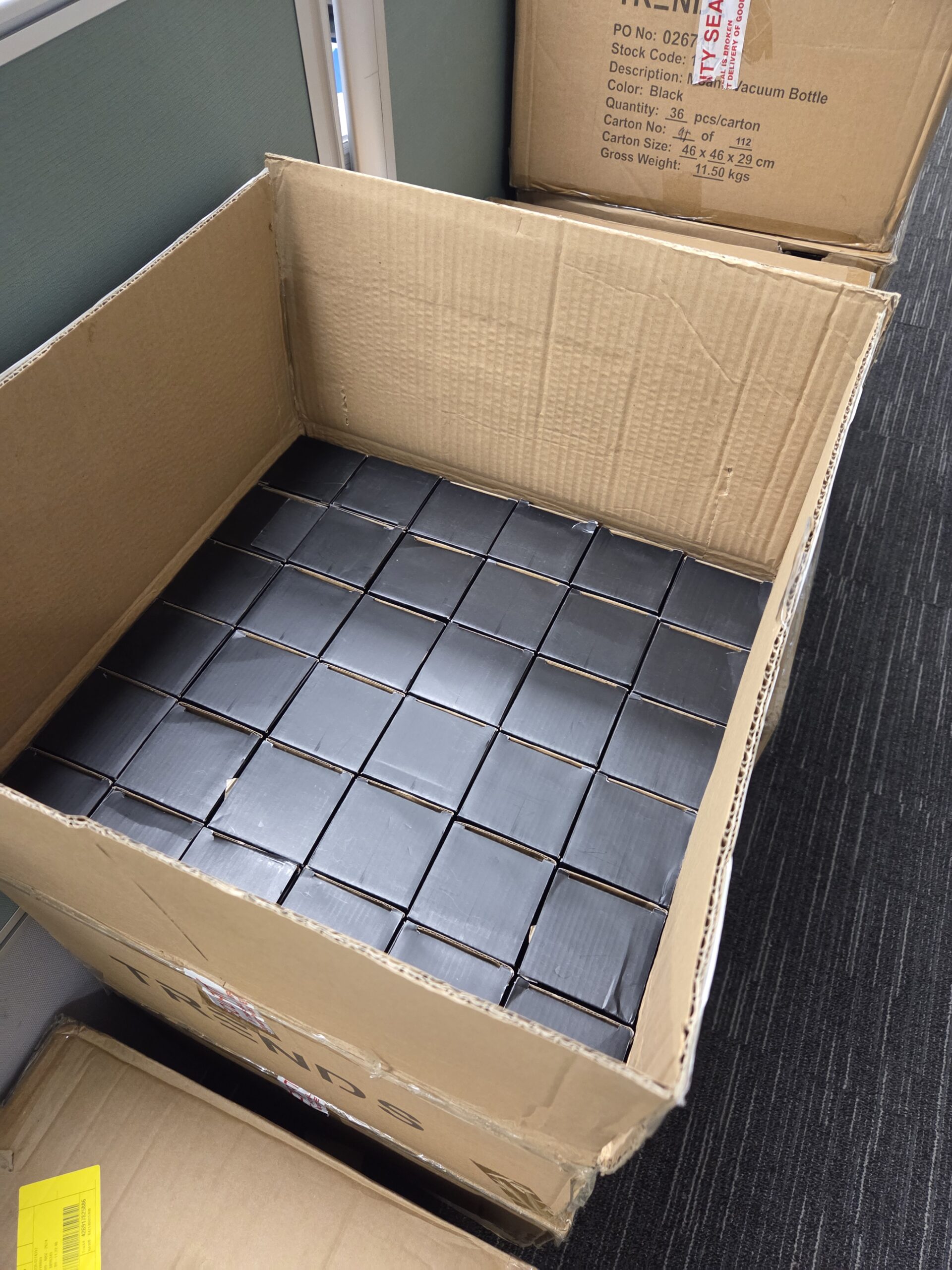 A delivery box filled with metal bottle box