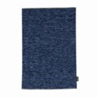A rectangular blue textured fabric cloth with a small black tag on the side.