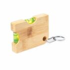 Small wooden keychain with two bubble levels embedded horizontally.