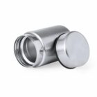 A stainless steel container with a screw-on lid placed beside it.
