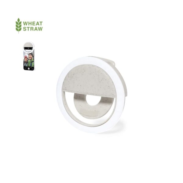 Round white clip-on selfie ring light made from wheat straw, shown with a phone.