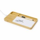 Wooden desk organizer with a notepad, pen, and charging cable, text says Call Marco.