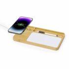 Bamboo desk organizer with phone charging, pen slot, and notepad.