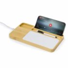 A bamboo desk organizer with phone stand, pen slot, and a built-in wireless charger.