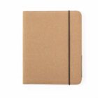 A closed brown notebook with a black elastic band wrapped vertically around it.