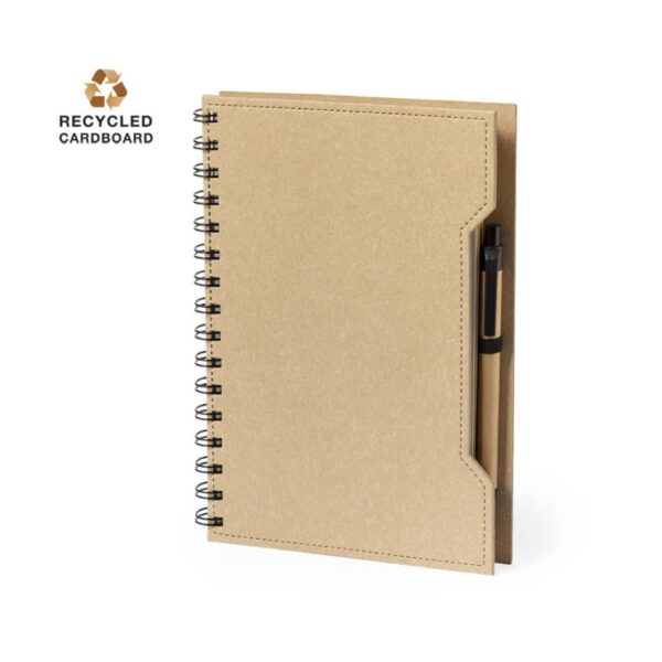 Brown spiral notebook with recycled cardboard cover and black pen attached on the right side.
