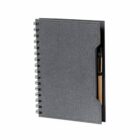 Gray spiral notebook with a pen tucked inside the front cover pocket.