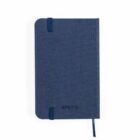 Closed blue notebook with elastic band and ribbon, viewed from above on white background.