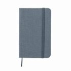 A gray fabric notebook with an elastic band and a ribbon bookmark.