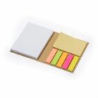 An open set of sticky notes and colorful page flags on a brown cardboard backing.