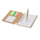 Open notebook with lined pages, sticky notes, and a pen on a brown cover.