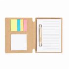 Open notebook with sticky notes, a pen, and lined paper on a brown cover.