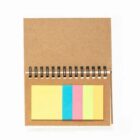 Open spiral notebook with colorful sticky notes attached on a brown cover, viewed from above.