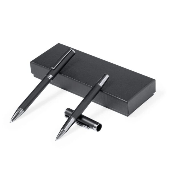 Two black pens with silver accents, one uncapped, next to a black rectangular box.