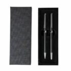 Black gift box with two black and silver pens inside, placed side by side.