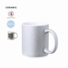 Silver glitter ceramic mug, 350 ml, with sublimation print example shown on the left.