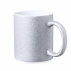 A silver glittery mug with a handle, on a white background.
