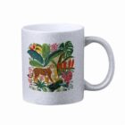 Silver glitter mug with a colorful leopard and tropical plant design.