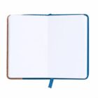 Open notebook with blank white pages and a blue ribbon bookmark.