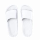 A pair of plain white slide sandals on a white background.