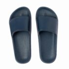 A pair of dark blue slide sandals on a white background.