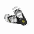 Black and white flip-flops with striped pattern and yellow logo on white background.