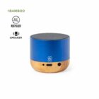 Blue and bamboo portable speaker with recycled material labels on a white background.