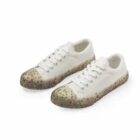 White sneakers with speckled, textured soles and toe caps, shown on a white background.