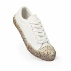 White sneaker with a speckled, textured sole on a plain white background.