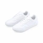 A pair of plain white lace-up sneakers on a white background.