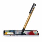 A stylus pen touching the screen of a smartphone displaying app icons.