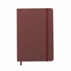 A closed brown notebook with an elastic band and a ribbon bookmark.