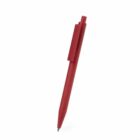 Red retractable ballpoint pen on a white background.