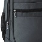 Close-up of a gray backpack with zippered pockets and a mesh side pocket.