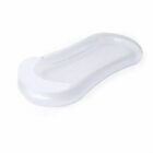 White plastic and mesh baby bath support with a contoured shape on a plain background.