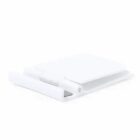 Folded white plastic chair shown from a low angle against a plain background.