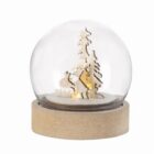 Wooden snow globe with a reindeer, tree, and light inside on a wooden base.