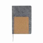 A gray notebook with a cork pocket on the front cover.