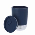 A navy blue stainless steel tumbler with a matching lid placed beside it.