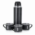 Black thermos flask with three matching cups arranged around its base.