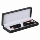 Black and gold pen in an open black gift box with a white interior.