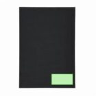 A black rectangular mat with a small green rectangle in the lower right corner.
