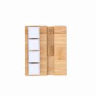 Four white cubes on a wooden rectangular tray against a white background, viewed from above.
