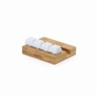 A small bamboo keypad with four white keys on a wooden base, isolated on a white background.