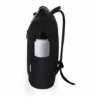 Black backpack with a white water bottle in the side pocket, shown from a side view.
